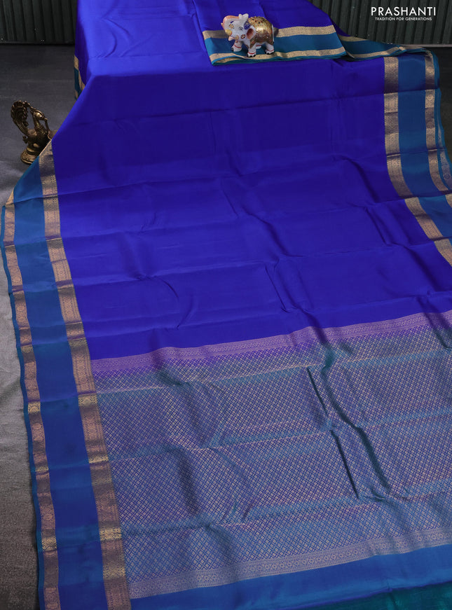 Kanchipuram silk saree blue and dual shade of teal green with plain body and rettapet zari woven border