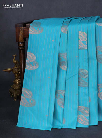 Kanchipuram silk saree teal blue and mild peach pink with allover copper zari weaves in borderless style