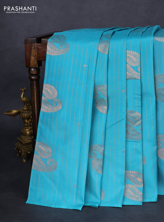 Kanchipuram silk saree teal blue and mild peach pink with allover copper zari weaves in borderless style