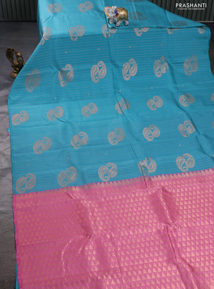 Kanchipuram silk saree teal blue and mild peach pink with allover copper zari weaves in borderless style