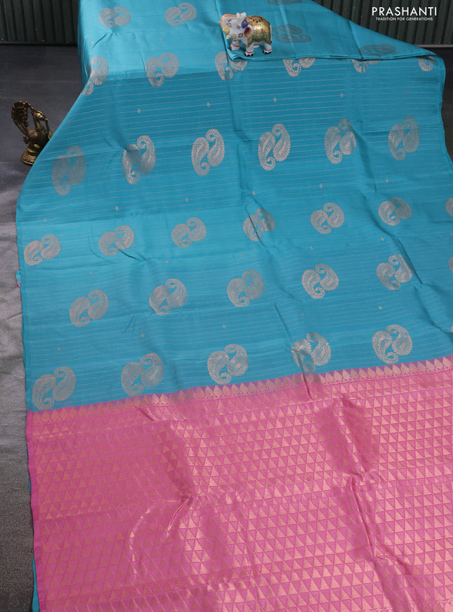 Kanchipuram silk saree teal blue and mild peach pink with allover copper zari weaves in borderless style