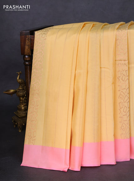 Kanchipuram silk saree cream and light pink with allover copper zari weaves and simple border