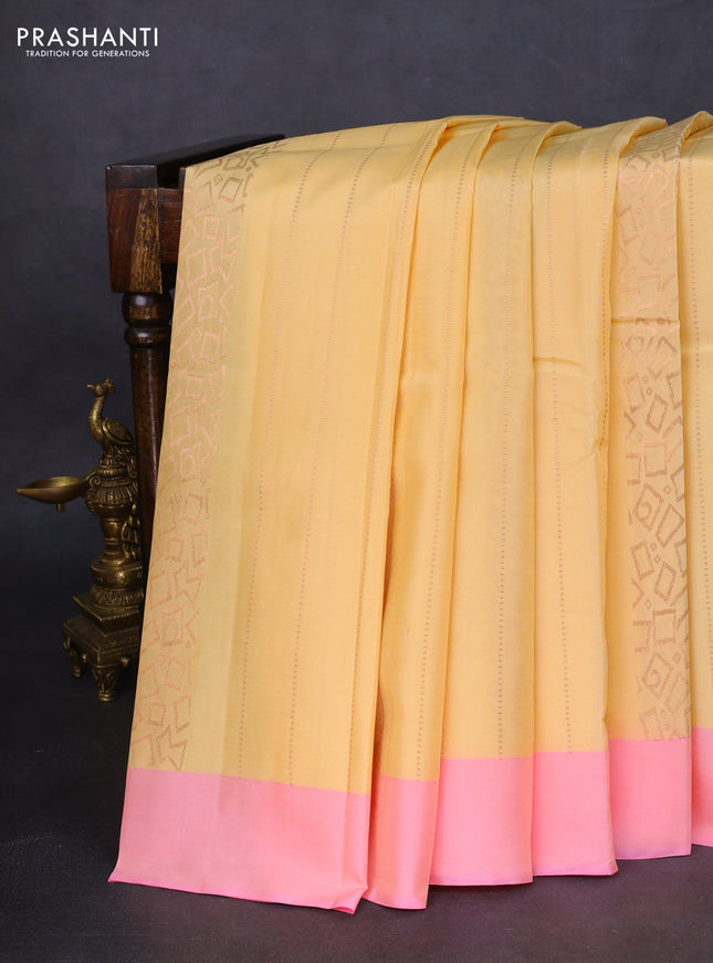 Kanchipuram silk saree cream and light pink with allover copper zari weaves and simple border