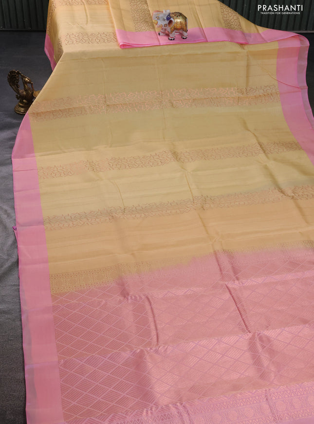 Kanchipuram silk saree cream and light pink with allover copper zari weaves and simple border