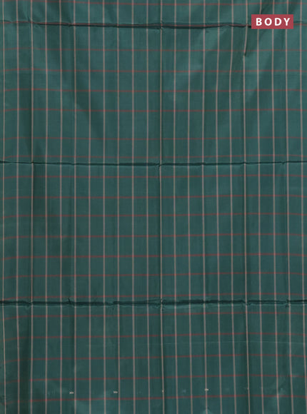 Banana pith saree bottle green and pastel maroon with allover checked pattern and piping border
