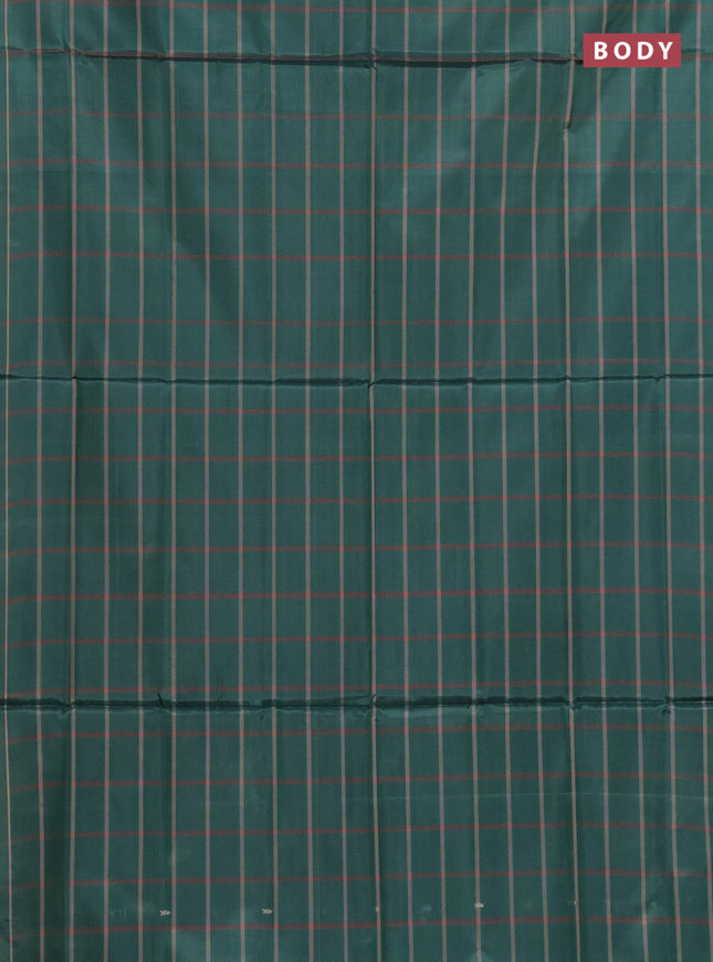 Banana pith saree bottle green and pastel maroon with allover checked pattern and piping border