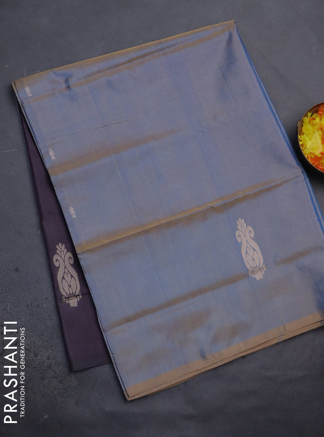 Banana pith saree dual shade of bluish rust and deep purple with thread woven buttas in borderless style