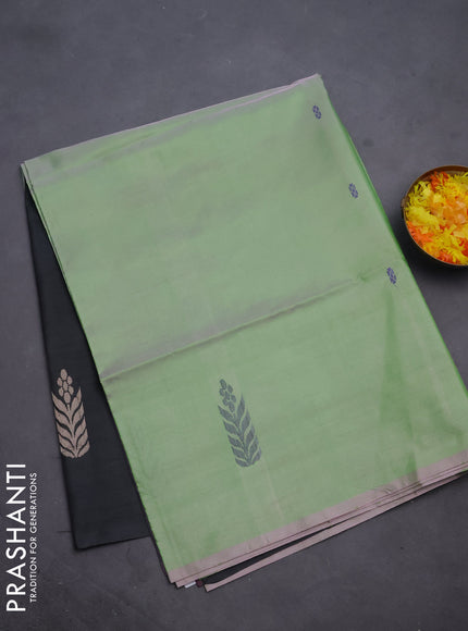 Banana pith saree dual shade of light green and black with thread woven buttas in borderless style