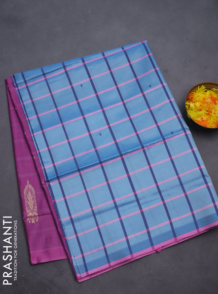 Banana pith saree blue shade and purple with allover checked pattern and piping border