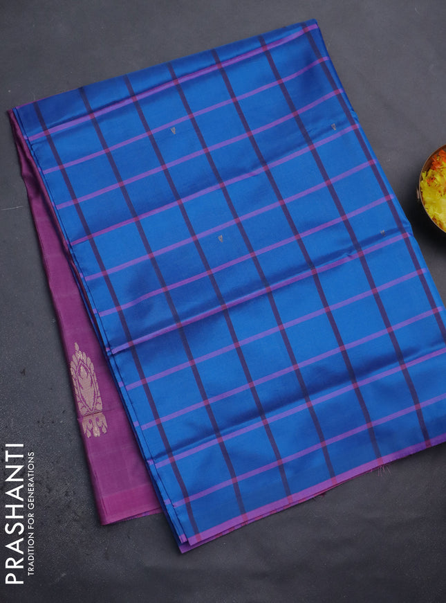 Banana pith saree cs blue and mild purple with allover checked pattern and piping border
