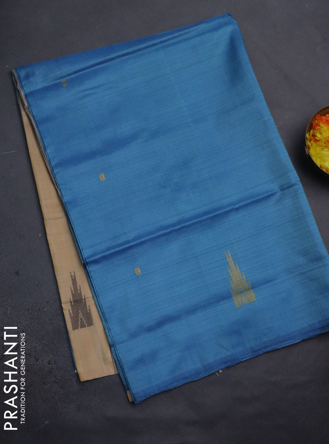 Banana pith saree cs blue and sandal with thread woven buttas in borderless style