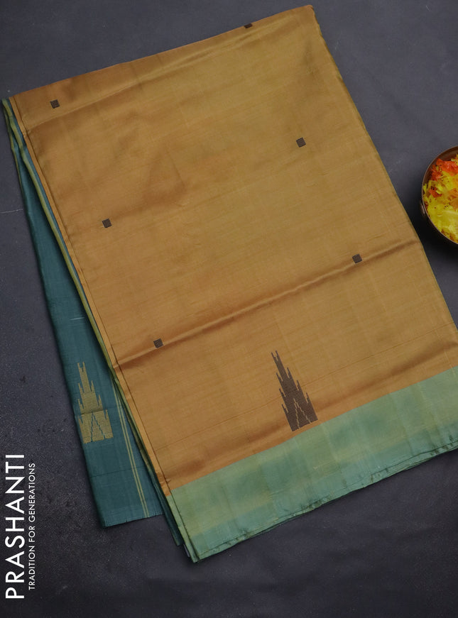 Banana pith saree mustard yellow and peacock green with thread woven buttas and contrast border