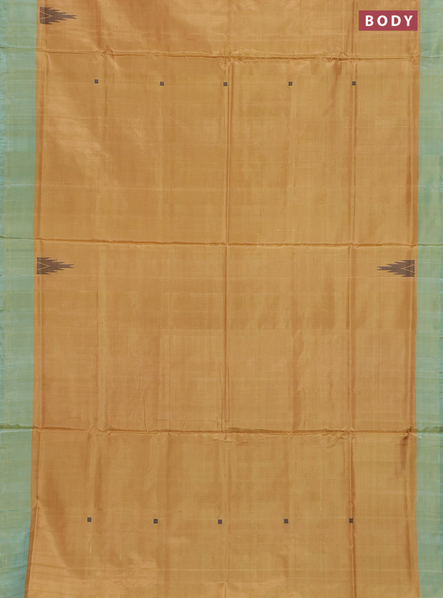 Banana pith saree mustard yellow and peacock green with thread woven buttas and contrast border