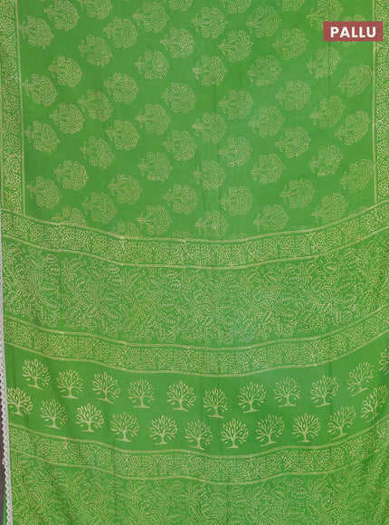 Semi pashmina silk saree light green and cream with allover floral butta prints and crocia lace work border