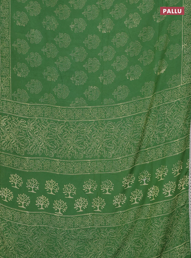 Semi pashmina silk saree green and cream with allover floral butta prints and crocia lace work border