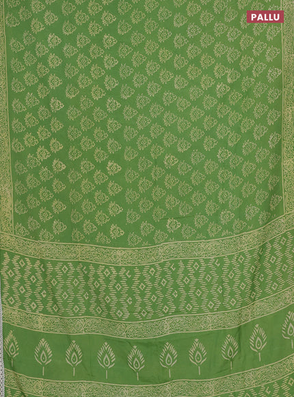 Semi pashmina silk saree light green and cream with allover butta prints and crocia lace work border
