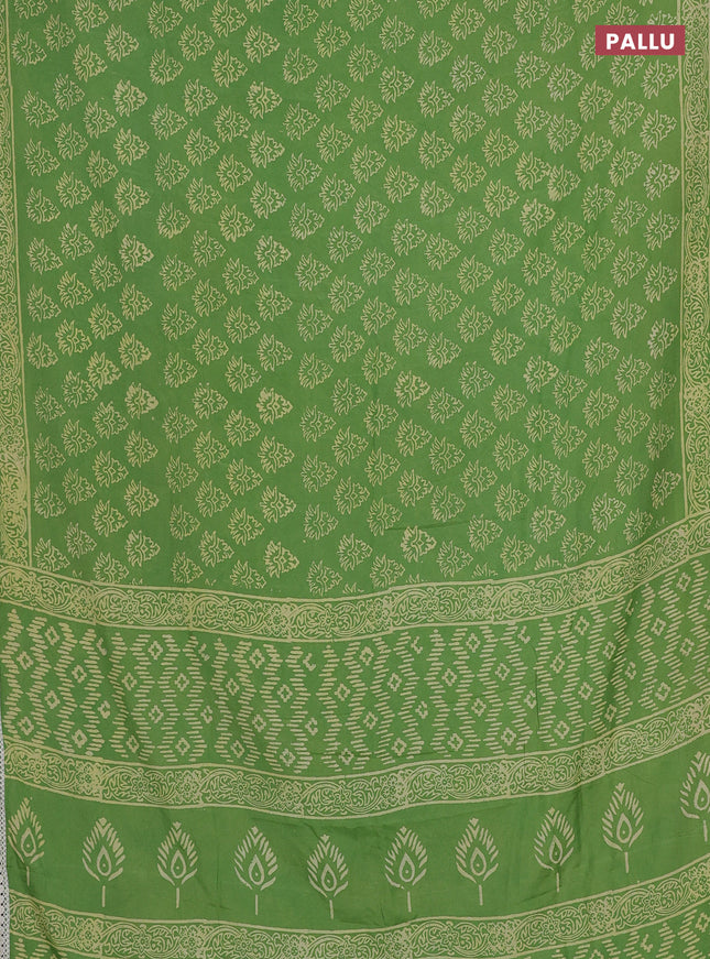 Semi pashmina silk saree light green and cream with allover butta prints and crocia lace work border