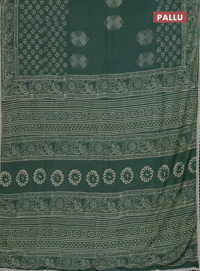 Semi pashmina silk saree green shade and cream with butta prints and crocia lace work border