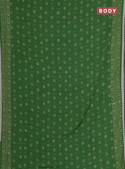 Semi pashmina silk saree green and cream with allover butta prints and crocia lace work border