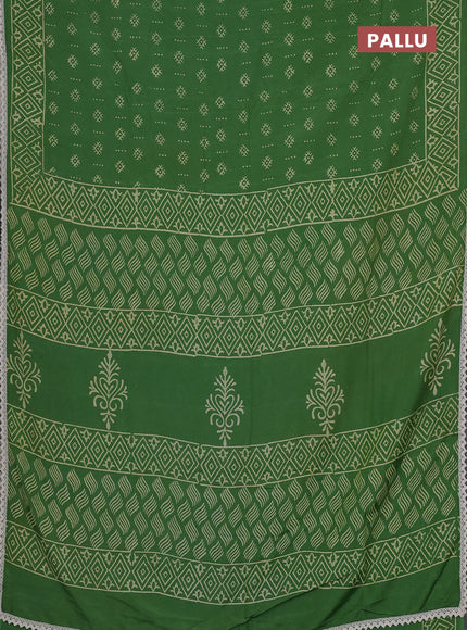 Semi pashmina silk saree green and cream with allover butta prints and crocia lace work border