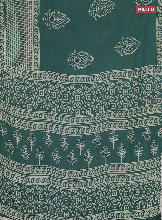 Semi pashmina silk saree teal green shade and cream with butta prints and long printed crocia lace work border