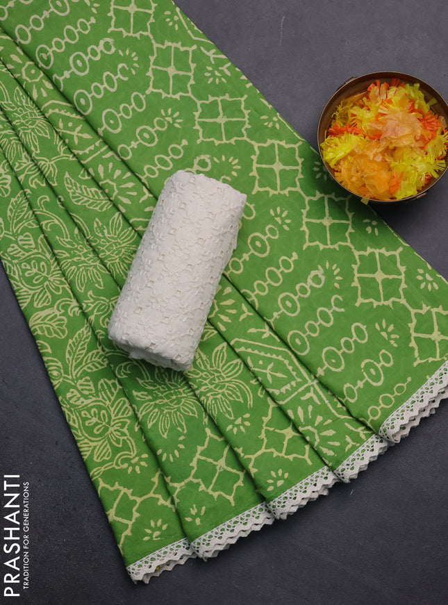 Semi pashmina silk saree light green and cream with allover prints and crocia lace work border