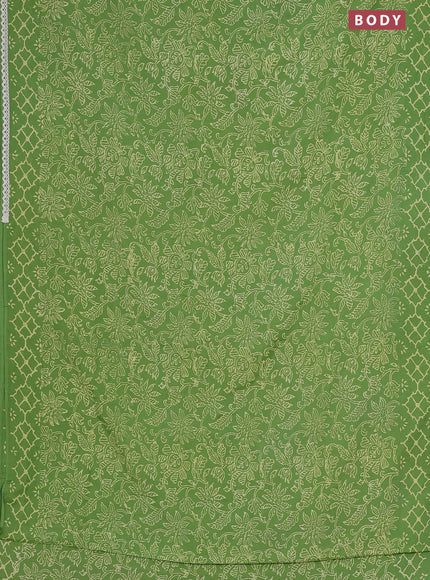 Semi pashmina silk saree light green and cream with allover prints and crocia lace work border