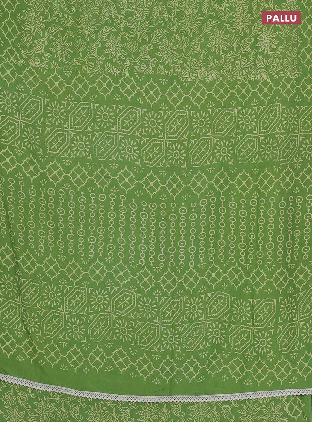 Semi pashmina silk saree light green and cream with allover prints and crocia lace work border