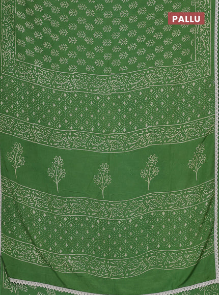 Semi pashmina silk saree green and cream with allover butta prints and crocia lace work border