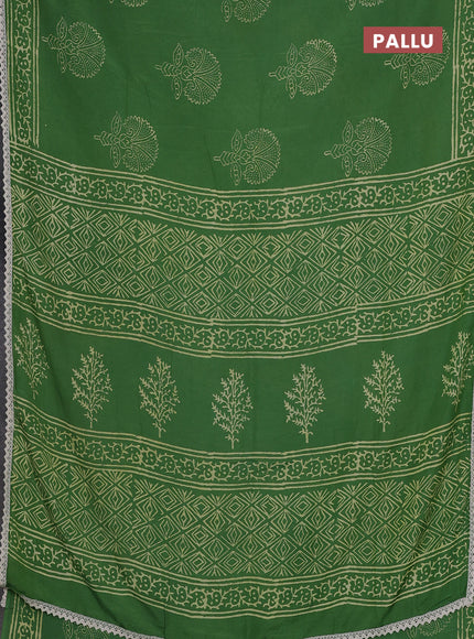Semi pashmina silk saree green and cream with butta prints and crocia lace work border
