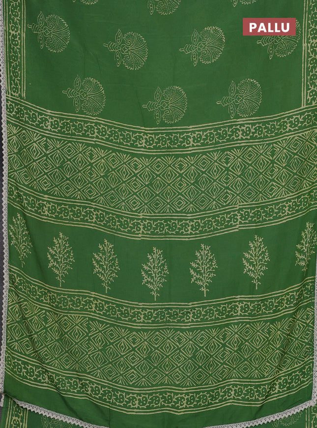 Semi pashmina silk saree green and cream with butta prints and crocia lace work border
