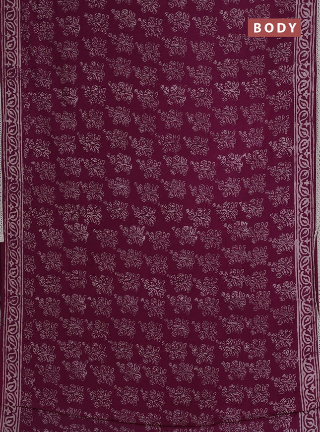 Semi pashmina silk saree wine shade with allover floral butta prints and crocia lace work border