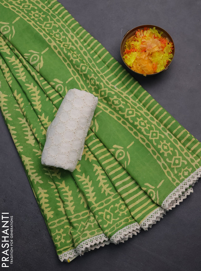 Semi pashmina silk saree light green and cream with allover prints and crocia lace work border