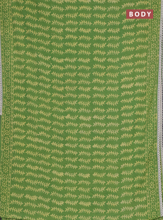 Semi pashmina silk saree light green and cream with allover prints and crocia lace work border