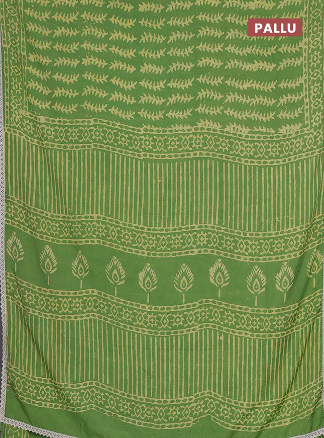 Semi pashmina silk saree light green and cream with allover prints and crocia lace work border