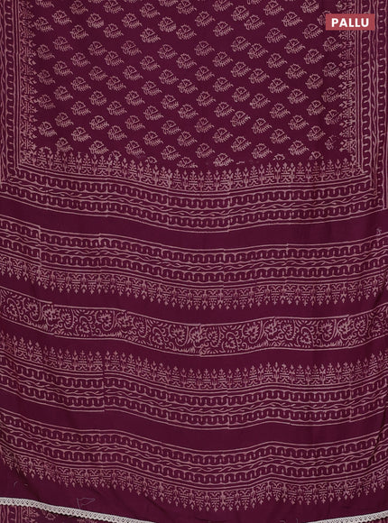 Semi pashmina silk saree wine shade and cream with allover butta prints and crocia lace work border