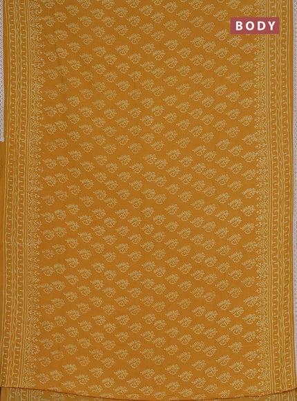 Semi pashmina silk saree mustard yellow and cream with allover butta prints and crocia lace work border