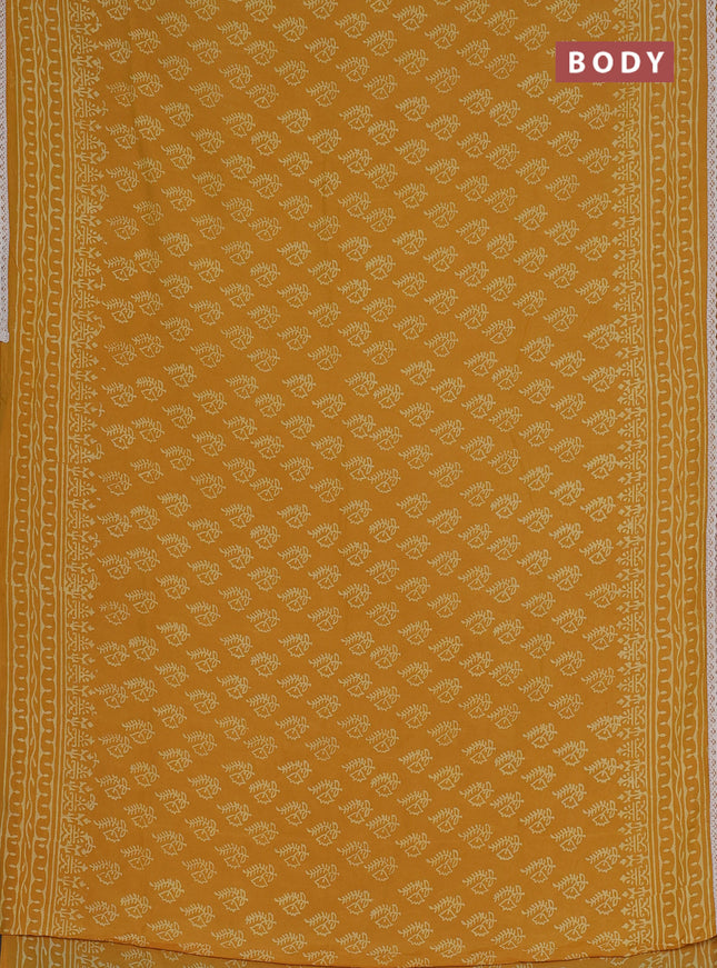 Semi pashmina silk saree mustard yellow and cream with allover butta prints and crocia lace work border