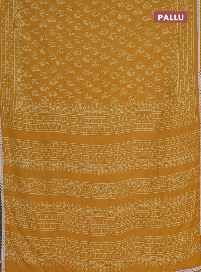 Semi pashmina silk saree mustard yellow and cream with allover butta prints and crocia lace work border