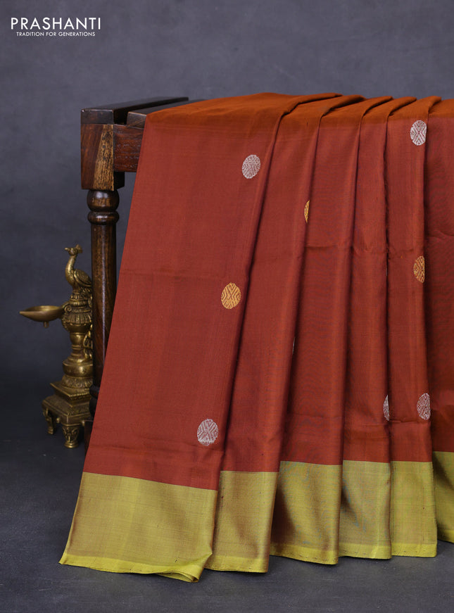 Pure uppada silk saree rust shade and mehendi green with silver & gold zari woven buttas and simple border