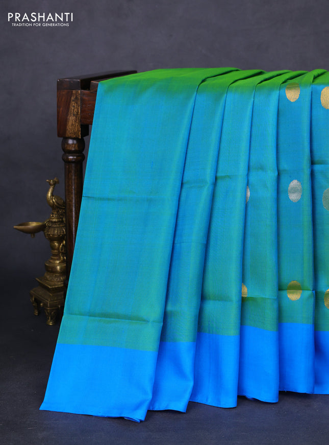 Pure uppada silk saree dual shade of teal green and cs blue with silver & gold zari woven coin buttas and simple border