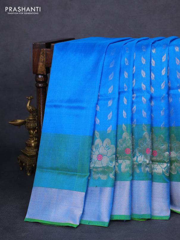 Pure uppada silk saree cs blue and dual shade of green with allover silver zari woven leaf buttas and silver zari woven border