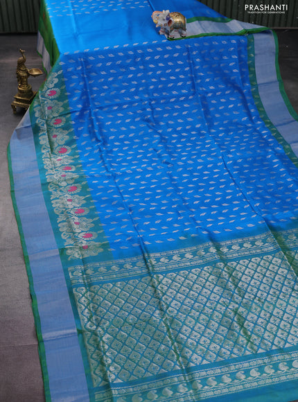Pure uppada silk saree cs blue and dual shade of green with allover silver zari woven leaf buttas and silver zari woven border