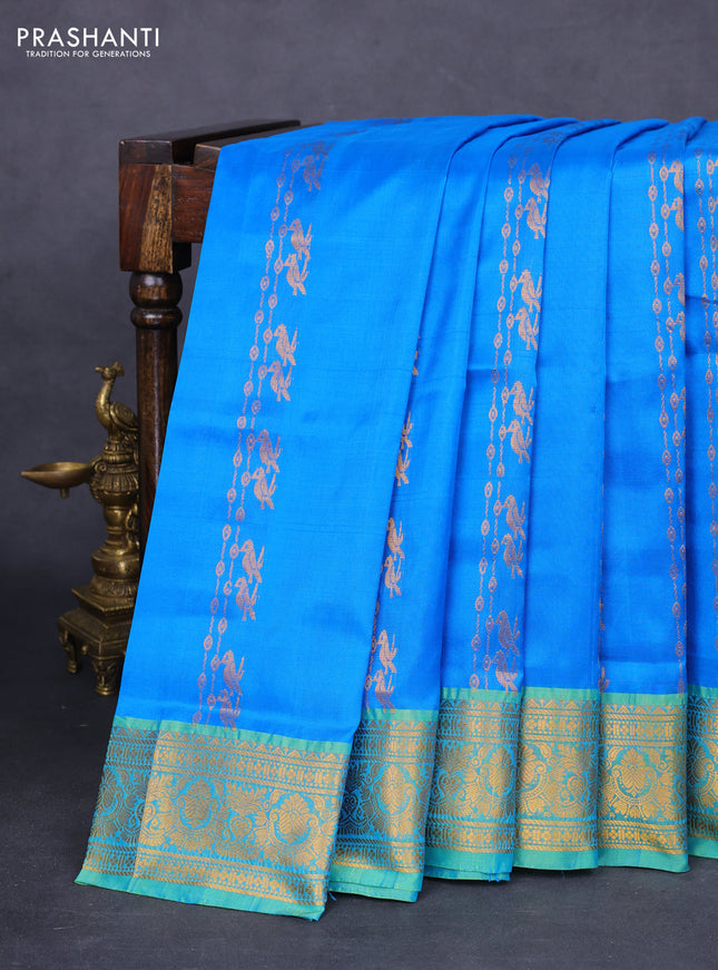 Pure uppada silk saree cs blue and green with allover zari weaves and zari woven border
