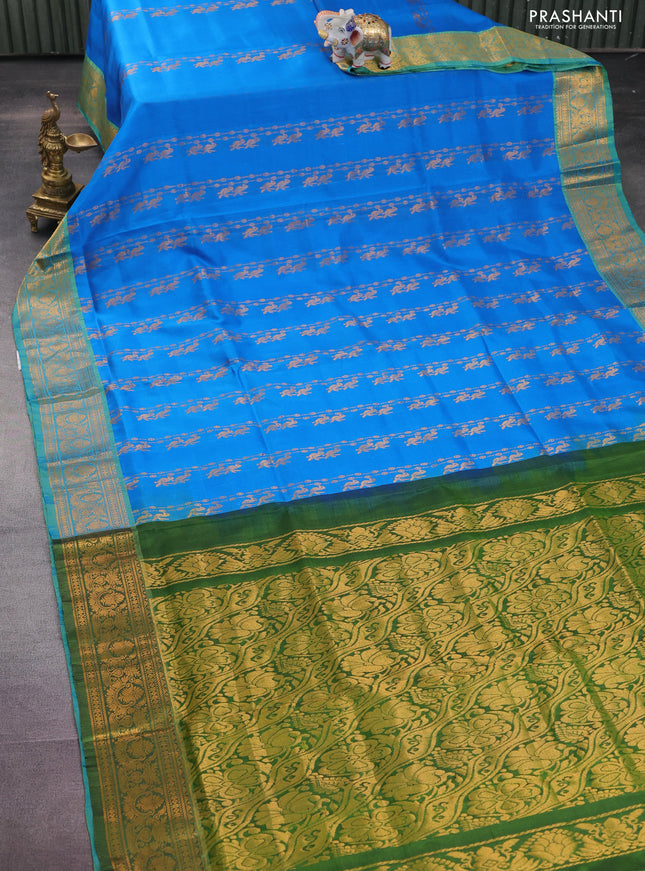 Pure uppada silk saree cs blue and green with allover zari weaves and zari woven border