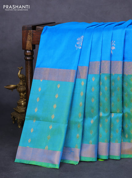 Pure uppada silk saree cs blue and dual shade of teal green with silver zari woven floral buttas and zari woven butta border