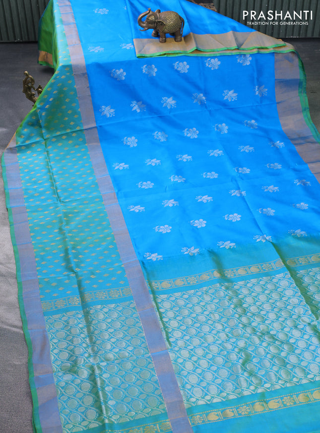 Pure uppada silk saree cs blue and dual shade of teal green with silver zari woven floral buttas and zari woven butta border
