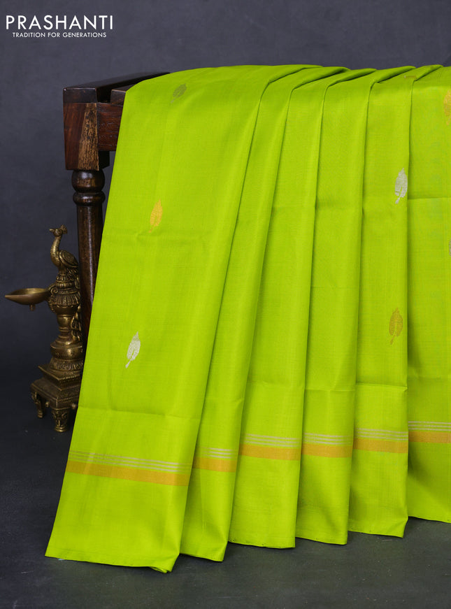 Pure uppada silk saree fluorescent green with silver & gold leaf zari buttas and zari woven simple border