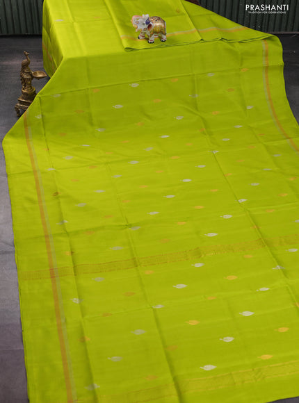 Pure uppada silk saree fluorescent green with silver & gold leaf zari buttas and zari woven simple border