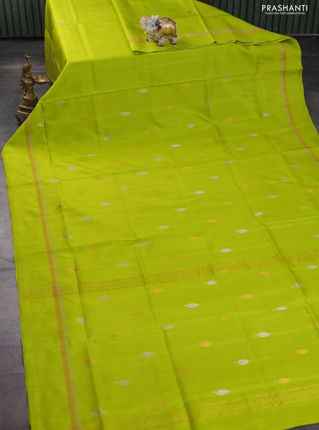 Pure uppada silk saree fluorescent green with silver & gold leaf zari buttas and zari woven simple border